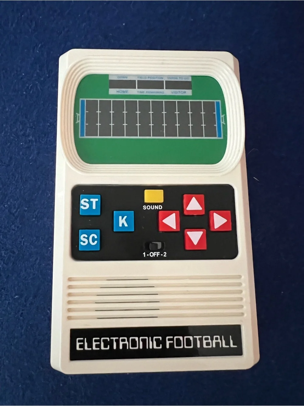 Mattel Electronic Football Handheld Game in White with Red and Blue Buttons